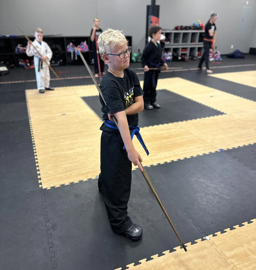 Children practicing martial arts in Angola, developing lifelong discipline, focus, and self-respect.