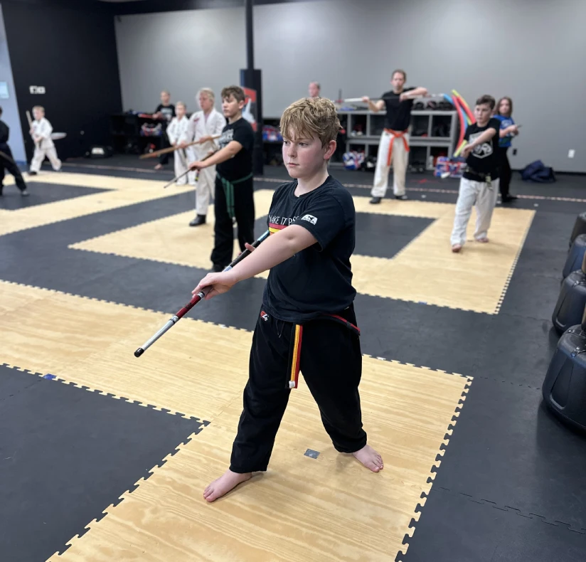 kids practicing martial arts in Angola, building confidence, focus, and discipline through martial arts training.