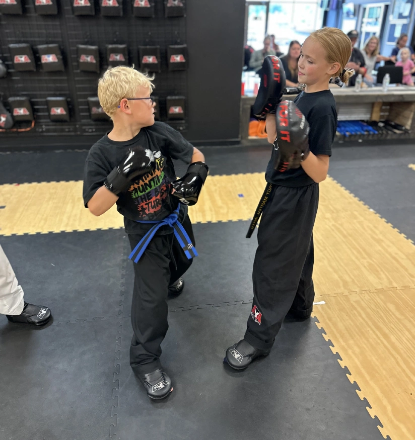 kids in Angola martial arts class improving focus, discipline, and listening skills through martial arts training